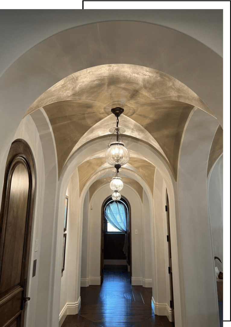 A hallway with arches and lights in it